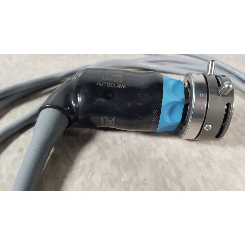 Black and blue autoclave connector with metallic housing of conmed im4123 true hd 1080p urology camera head back side