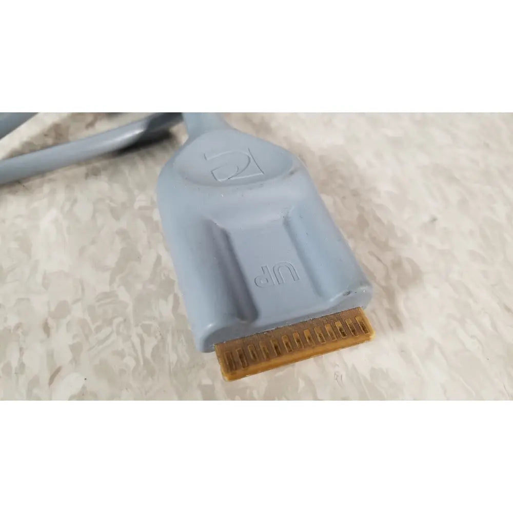Gray plastic dvi connector with gold pin array and embossed dvi branding on the back of conmed im4123 true hd 1080p camera head