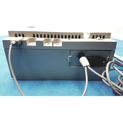 Gray conmed model 2000 high frequency equipment back view with beige plastic vents and black power plug