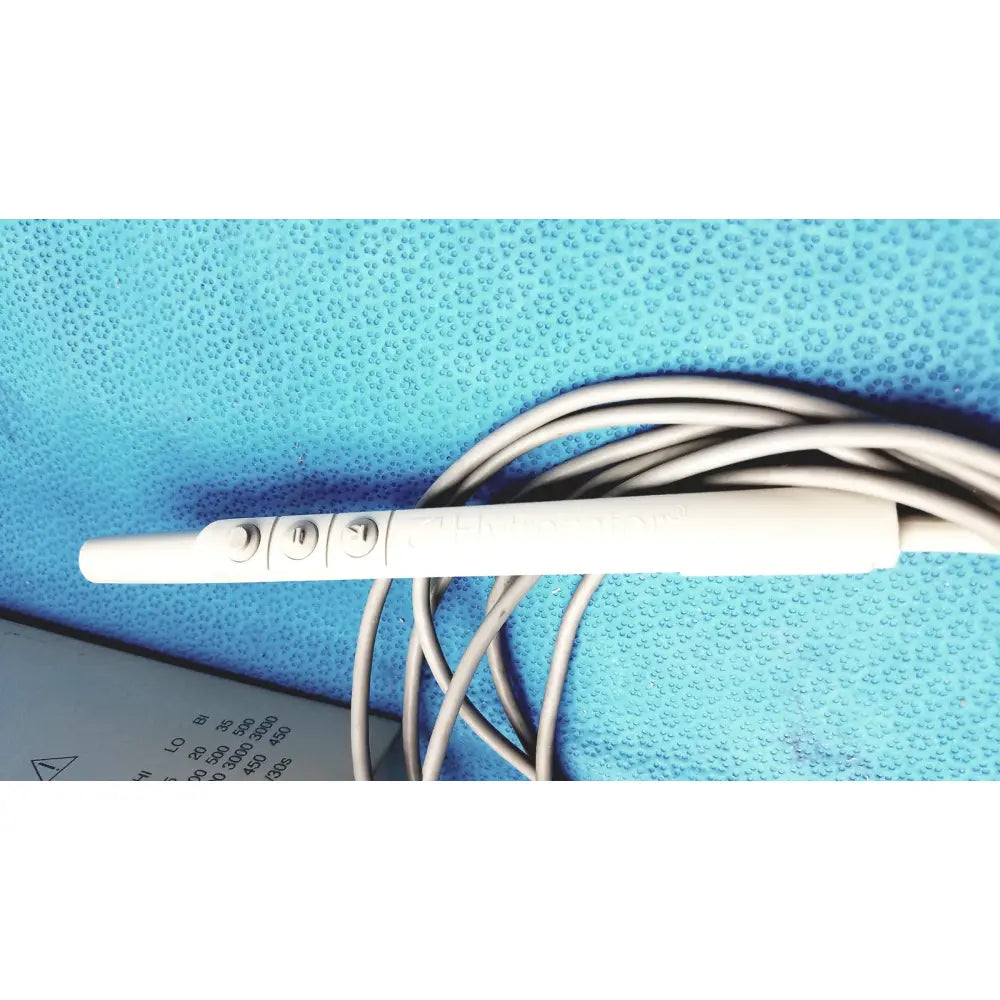 White plastic ecg electrode with three circular contact points and coiled gray cable for conmed model 2000 high frequency equipment