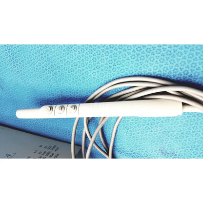 White plastic ecg electrode with three circular contact points and coiled gray cable for conmed model 2000 high frequency equipment