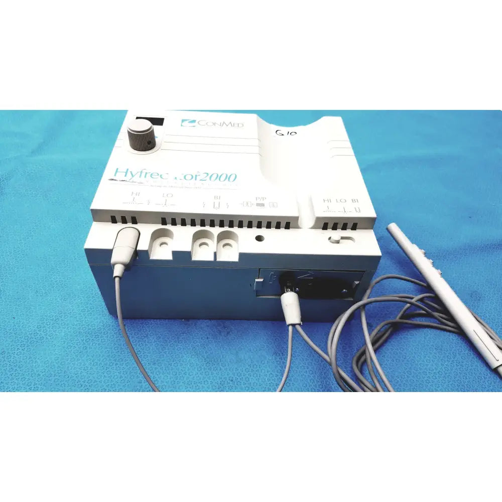 White and blue Conmed Model 2000 high frequency equipment with gray cables and silver-handled probe for medical use