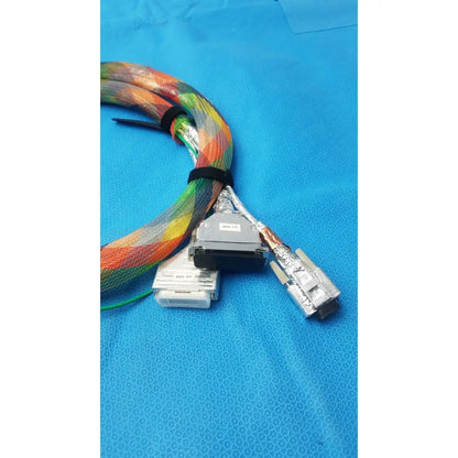 Connector stbu to egse cable featuring a colorful braided rainbow pattern with durable metallic connectors for reuse medical use