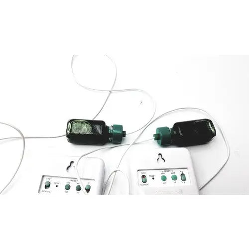 Black plastic control company traceable thermometer with green caps and wires paired with white panels for traceable refrigerator freezer monitoring