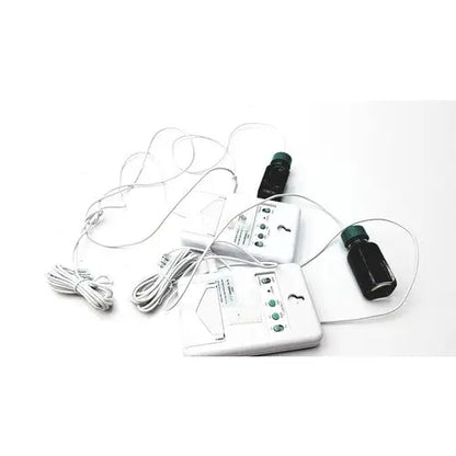 White control company traceable refrigerator freezer thermometer with green buttons and two black bottles with green caps attached wires