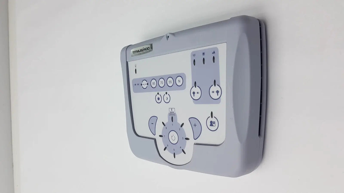 Gray plastic control panel with white faceplate and circular buttons for titmus i400 vision screener use