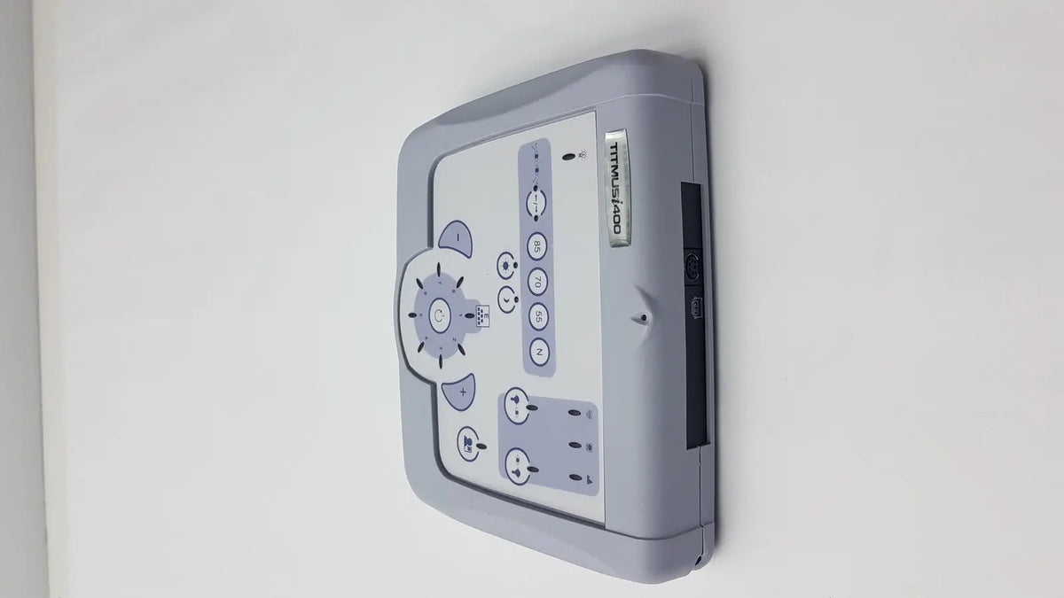 Gray plastic control panel for titmus i400 vision screener featuring buttons and a dial for device operation