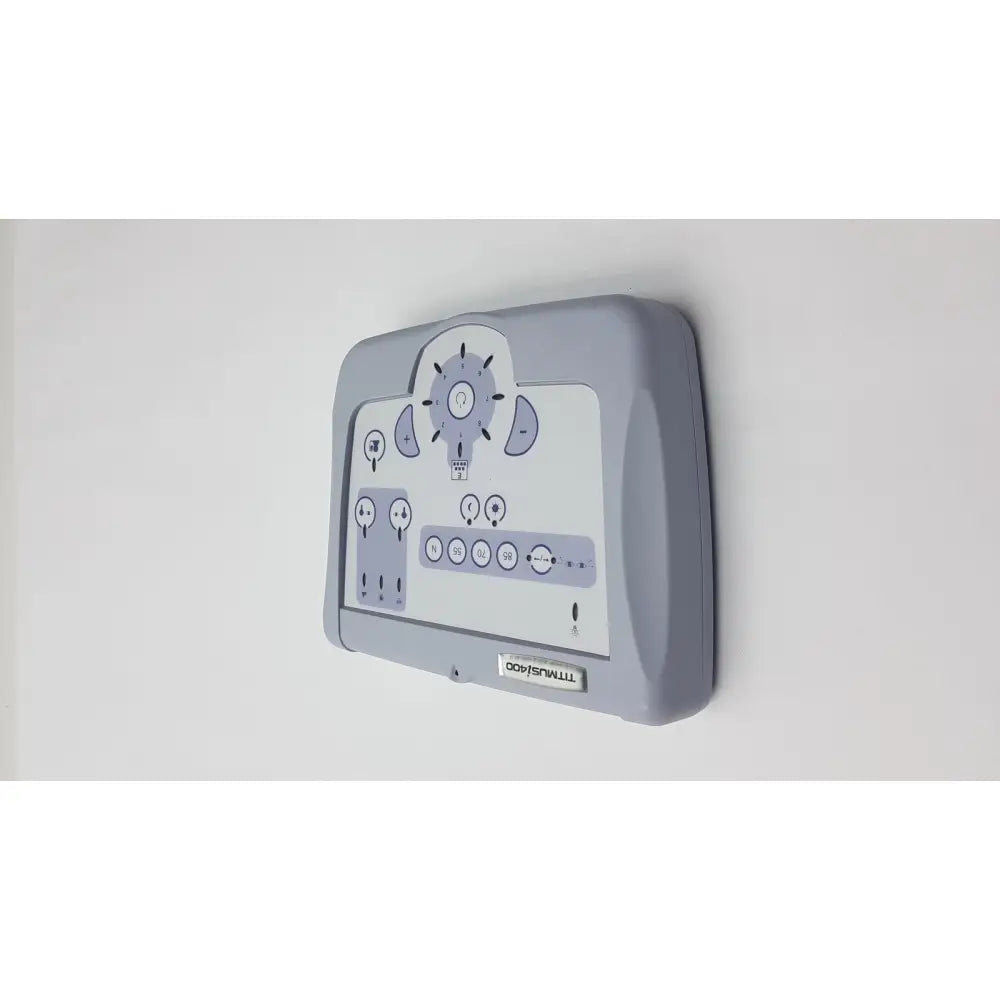 Gray plastic wall-mounted control panel with white display and dials for titmus i400 vision screener use