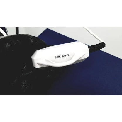 White plastic power adapter with black coiled cable and serial label for cooper surgical lumax ts pro fiberoptic cystometry system