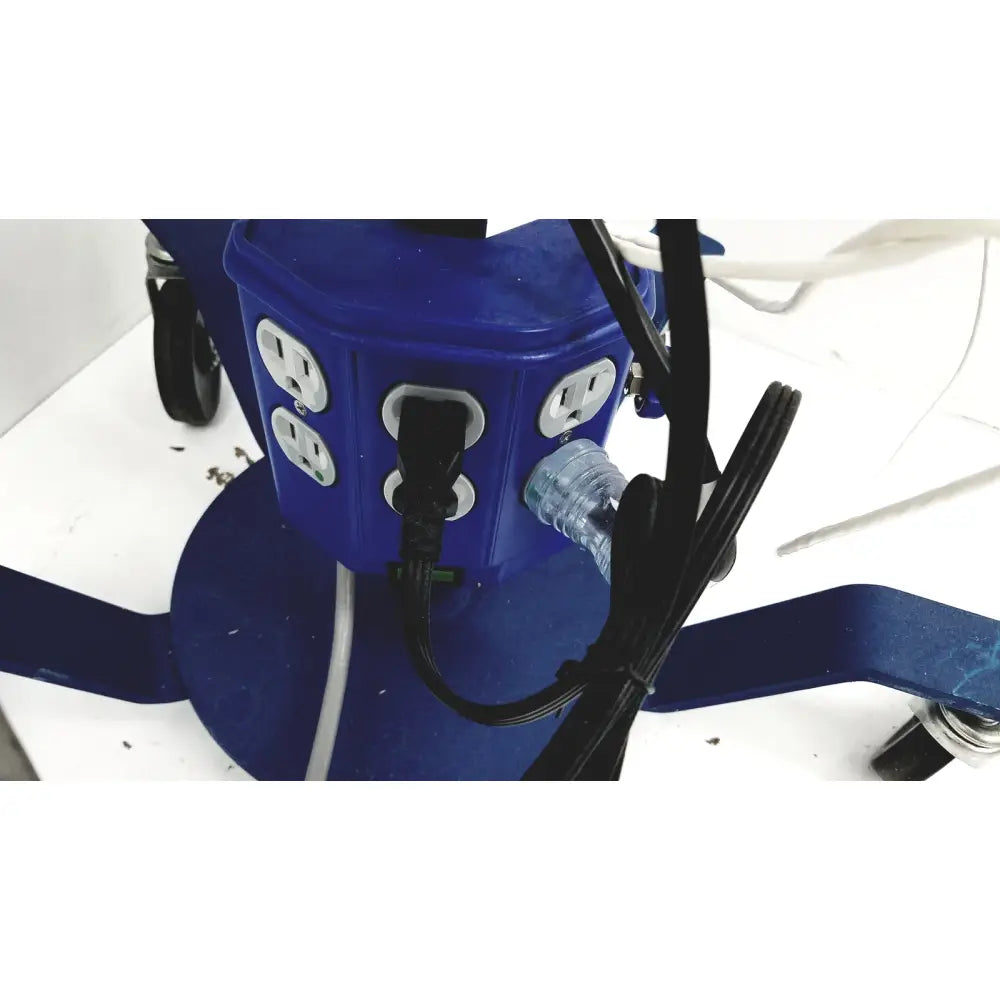 Blue plastic multi-outlet power strip with white sockets and cords plugged in for cooper surgical lumax ts pro fiberoptic cystometry system