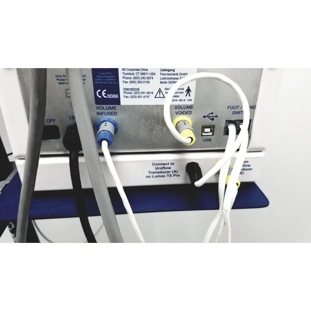 White tubing with blue and yellow connectors connected to the cooper surgical lumax ts pro fiberoptic cystometry device