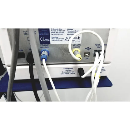 White tubing with blue and yellow connectors connected to the cooper surgical lumax ts pro fiberoptic cystometry device