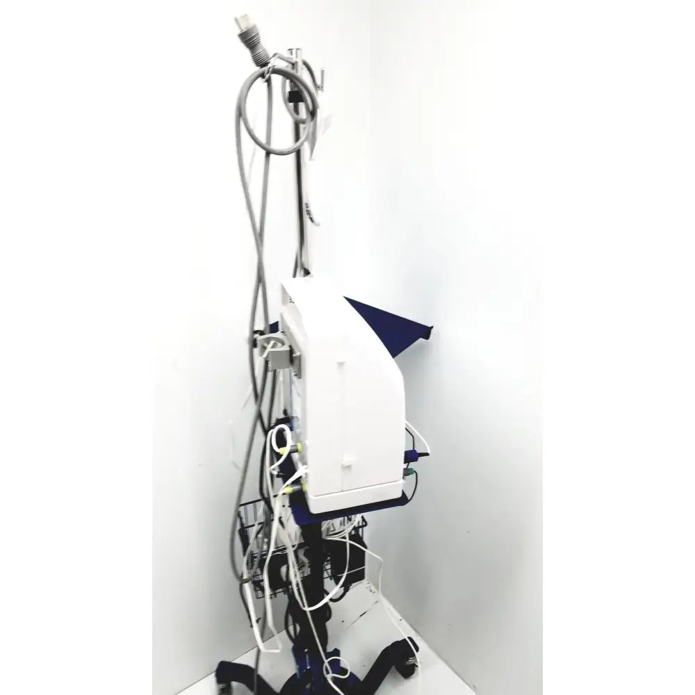 White cooper surgical lumax ts pro fiberoptic cystometry system with blue accents and gray power cord on black cart