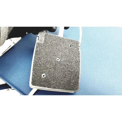 Gray textured grip pad with three circular holes and white border for cooper surgical lumax ts pro fiberoptic cystometry system