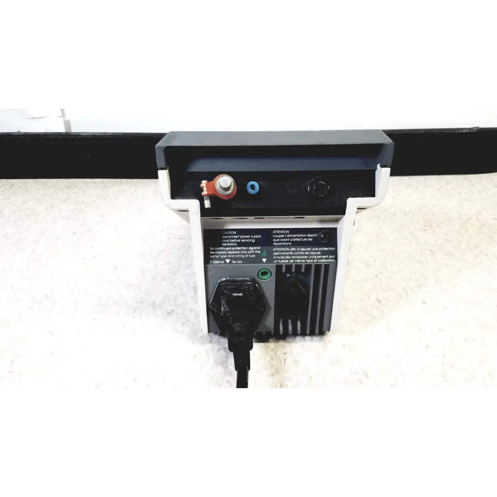 Black and white power supply unit with red terminal blue port green indicator light and black plug for corning meter 120v 60hz