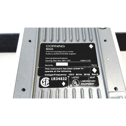 Silver metallic corning 245 ph meter 120v 60hz with black sticker detailing specifications and certifications