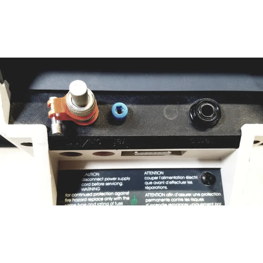 Orange and silver adjustable knob with blue plastic cap on black panel at back of corning 245 ph meter 120v 60hz