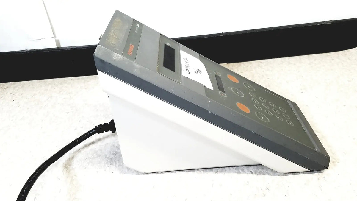 Gray and white countertop cash register with orange buttons for corning 245 ph meter 120v 60hz reuse medical use