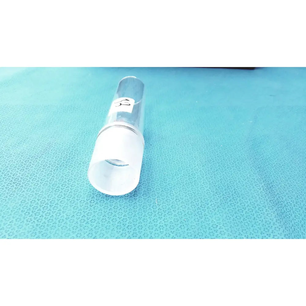 Clear glass cylindrical ground joint adapter with frosted white cap and metallic band for corning laboratory glassware