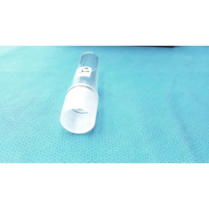 Clear glass cylindrical ground joint adapter with frosted white cap and metallic band for corning laboratory glassware