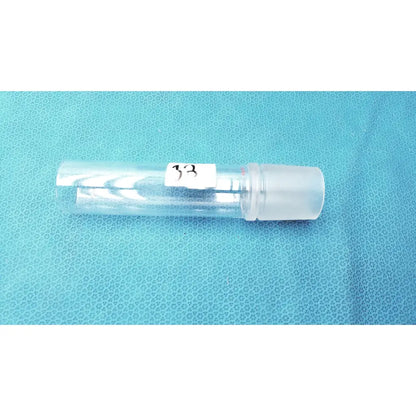 Clear plastic vial with white label 33 and translucent cap used with corning laboratory glassware ground joint adapter