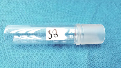 Clear plastic Corning laboratory glassware vial with frosted cap and white label 38 for 45/50 ground joint adapter use