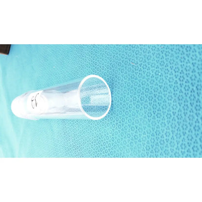 Clear plastic test tube with white cap and black markings as part of corning laboratory glassware ground joint adapter