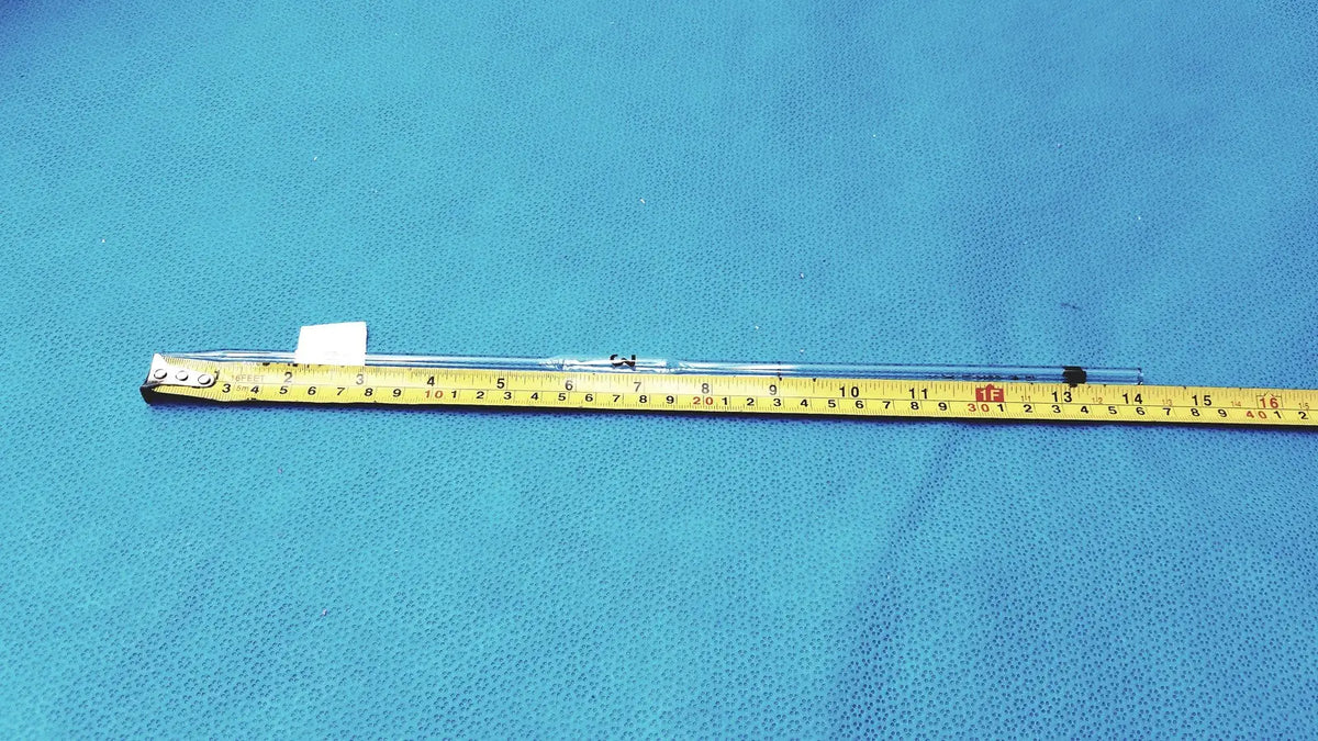 Corning pyrex 3ml reusable glass volumetric pipette with transparent tube, metallic cap, and black end piece on blue surface