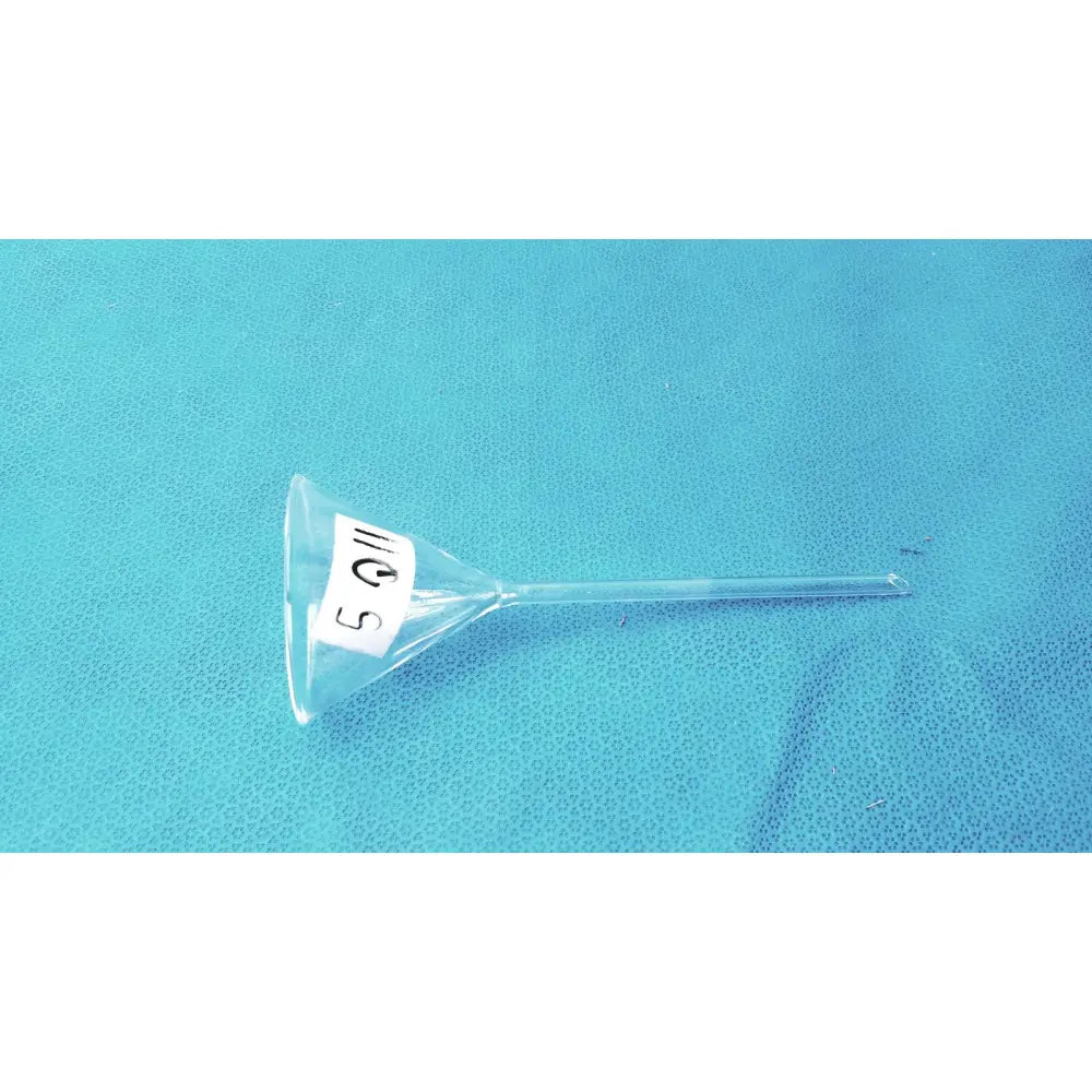 Clear plastic corning pyrex fluted funnel with white 5 q label and long stem lab glassware for precise pouring