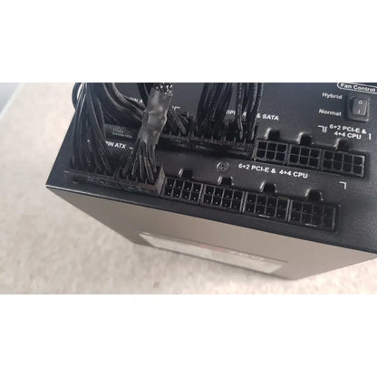 Black plastic fully modular power supply with multiple cable connectors and fan control switch corsair ax760 760w model