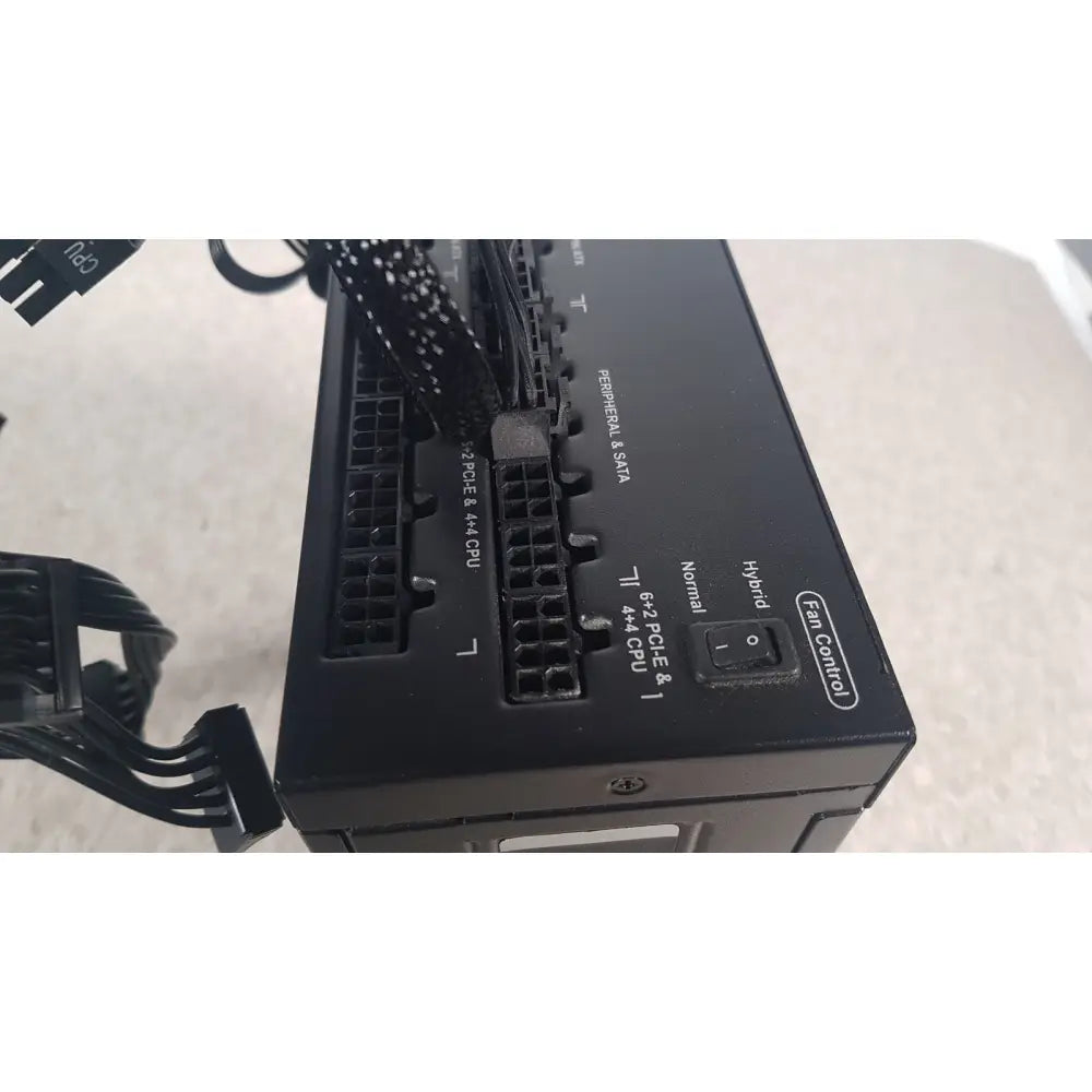 Black corsair ax760 760w fully modular power supply back side showing labeled ports and fan control switch