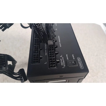 Black corsair ax760 760w fully modular power supply back side showing labeled ports and fan control switch