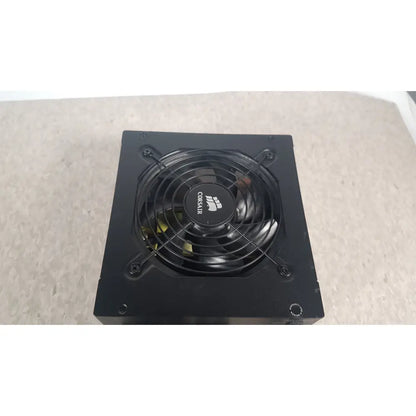 Black corsair ax760 760w fully modular power supply with circular fan and logo on the front panel