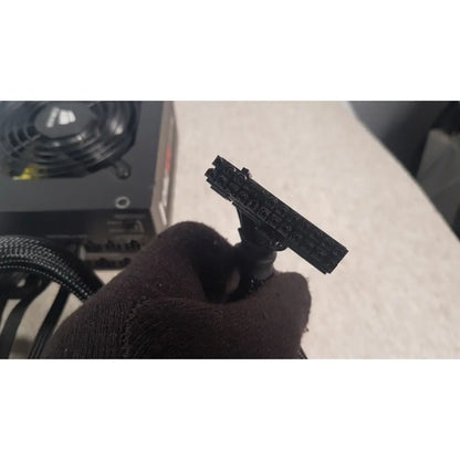 Black plastic 8-pin pcie power connector held in hand for corsair ax760 760w fully modular power supply unit