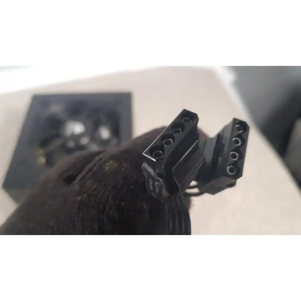 Black plastic power connector with multiple circular pins on the back of corsair ax760 760w fully modular power supply