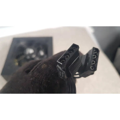 Black plastic power connector with multiple circular pins on the back of corsair ax760 760w fully modular power supply