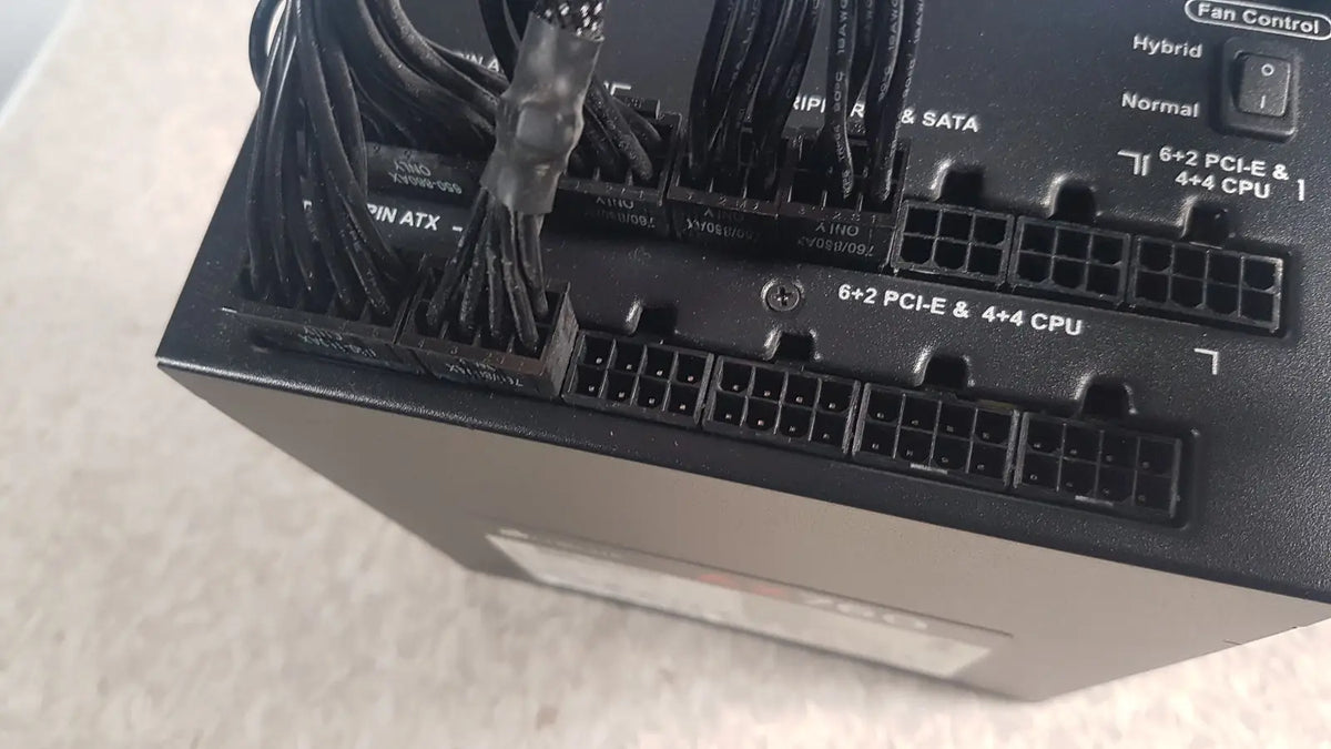 Black corsair ax760 760w fully modular power supply with multiple labeled cable connectors and ports on the back side