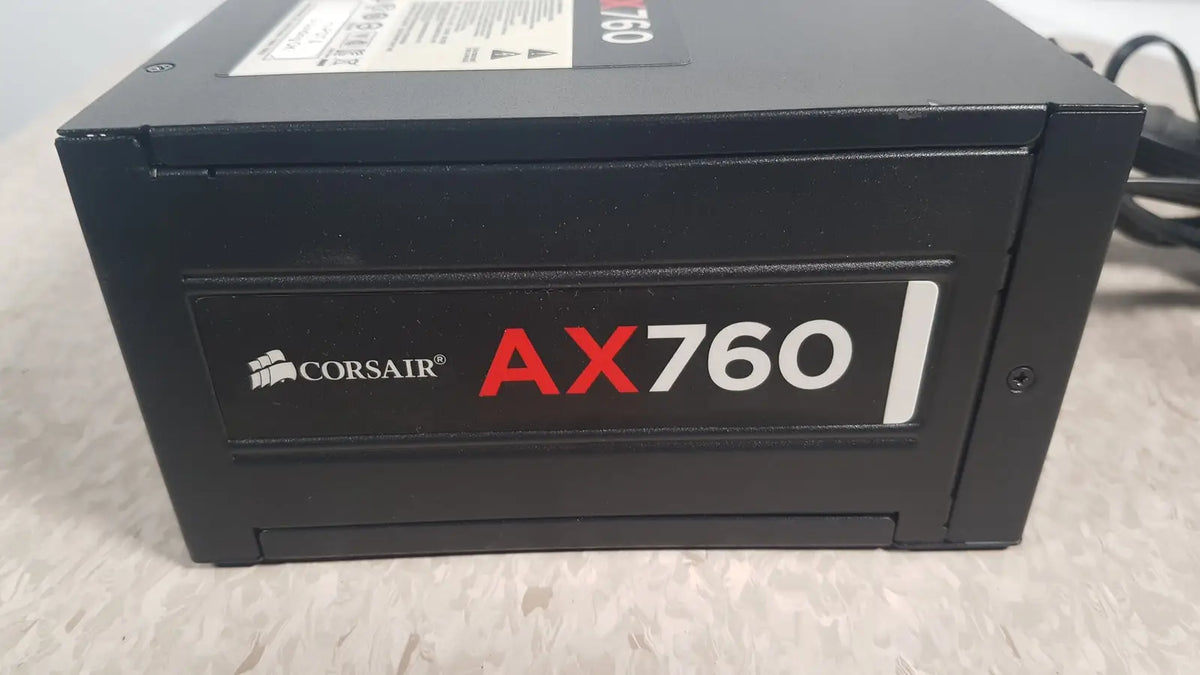Black corsair ax760 760w fully modular power supply with red and white branding for efficient PC power management