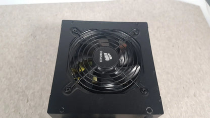 Black corsair ax760 760w fully modular power supply with circular fan and logo on the front panel