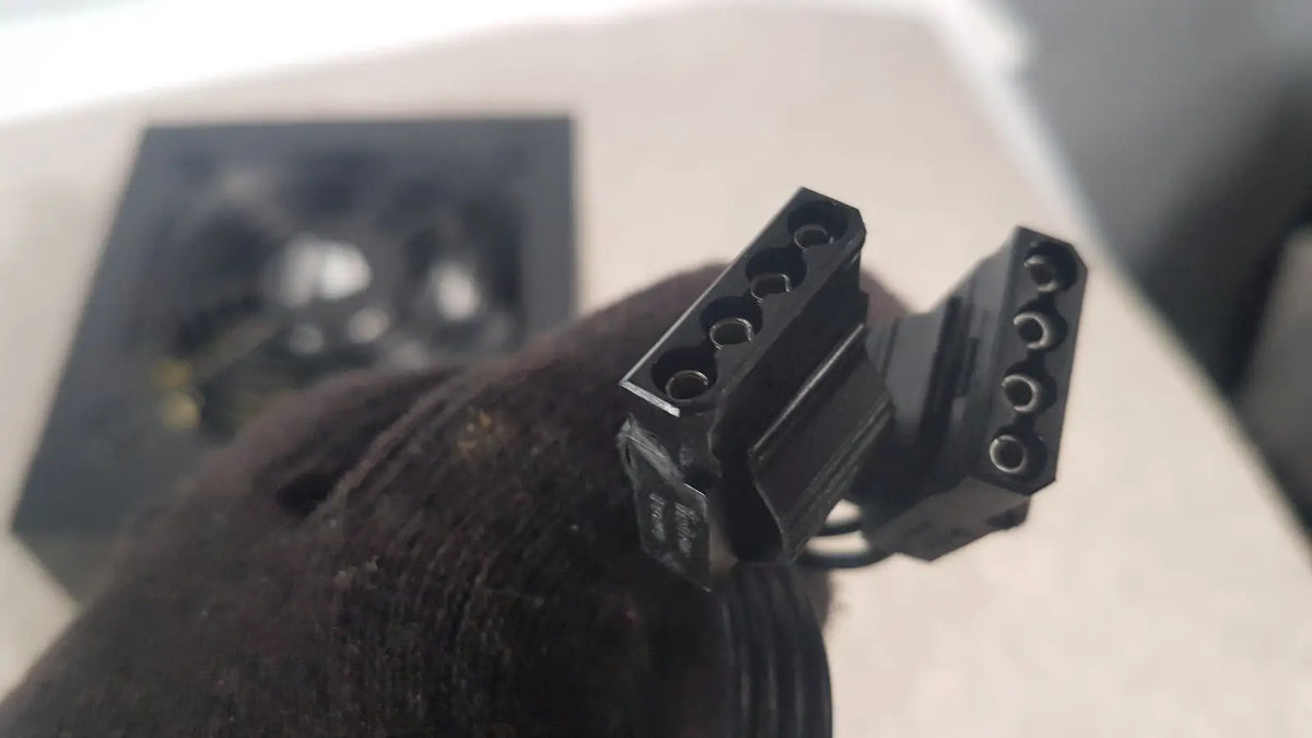 Black plastic power connector with multiple circular pins on the back of corsair ax760 760w fully modular power supply