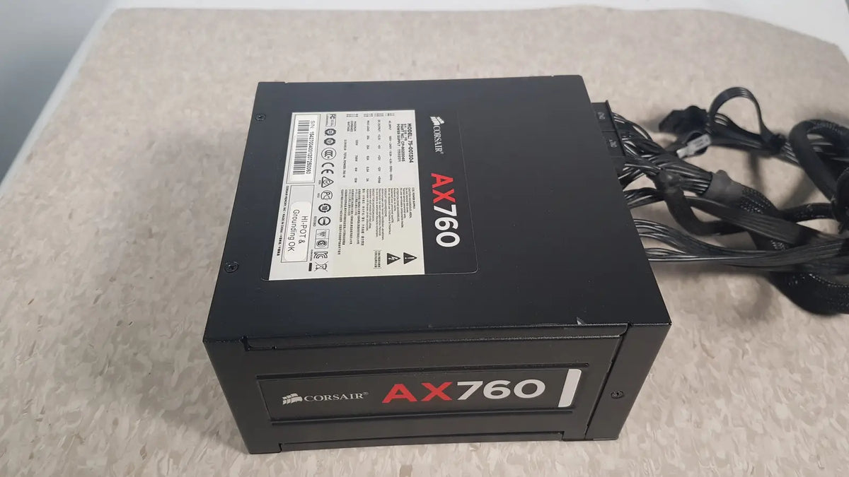 Black corsair ax760 760w fully modular power supply with matte finish and red branding for efficient PC builds