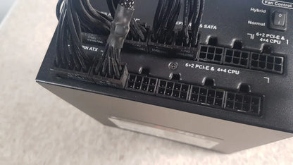 Black plastic fully modular power supply with multiple cable connectors and fan control switch corsair ax760 760w model