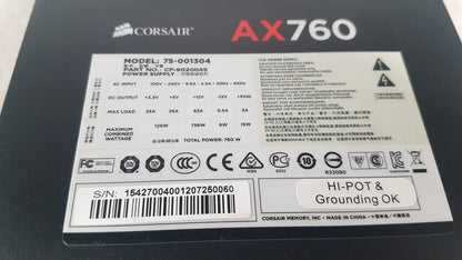 Black corsair ax760 760w fully modular power supply unit with white labeling and specifications visible on the back side