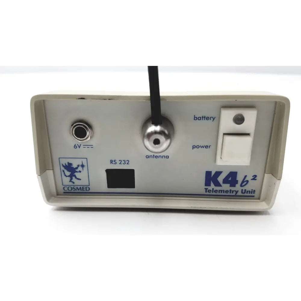 Beige plastic cosmed k4 b2 metabolic telemetry unit with silver antenna port and power switch for reuse medical applications