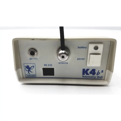 Beige plastic cosmed k4 b2 metabolic telemetry unit with silver antenna port and power switch for reuse medical applications