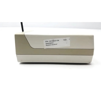 Beige plastic receiver unit with black antenna labeled k4 model from cosmed k4 b2 metabolic for reuse medical purposes