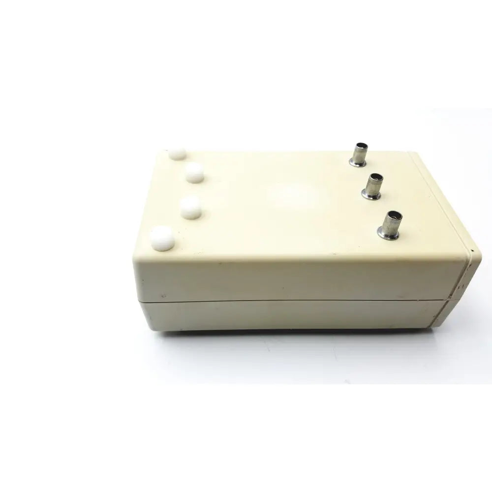 Cream-colored Cosmed K4 B2 metabolic electronic device with four white push buttons and three metallic ports for reuse medical use