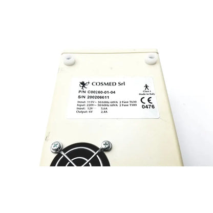 Cream-colored rectangular power supply unit for cosmed k4 b2 metabolic with technical specs label for reuse medical use