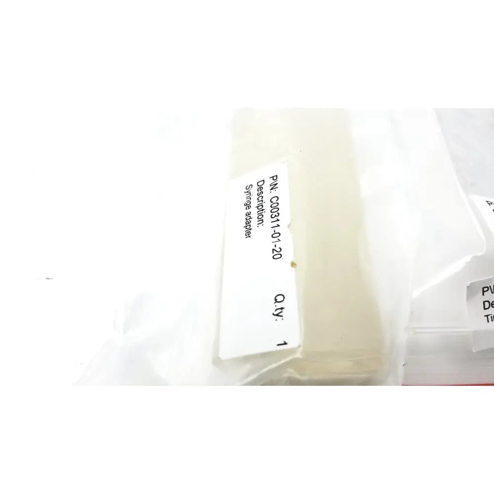 Clear plastic syringe adapter in transparent packaging bag labeled c00311-01-20 for reuse medical cosmed k4 b2 metabolic product
