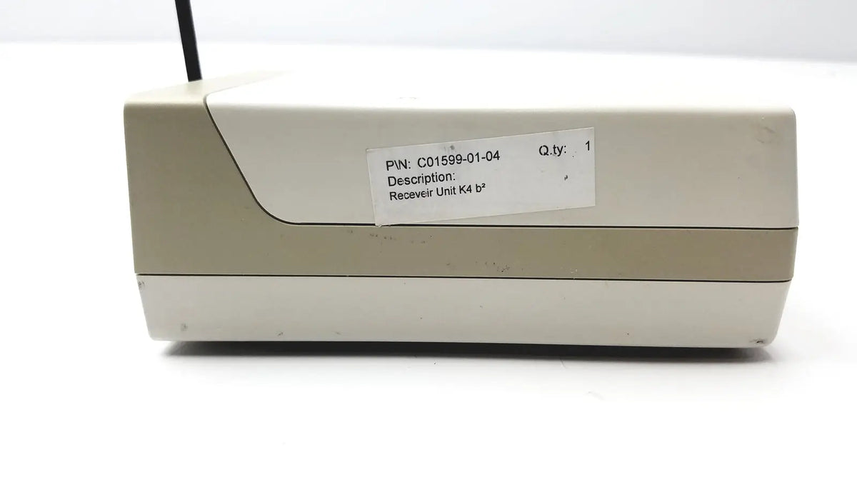Beige plastic receiver unit with black antenna labeled k4 model from cosmed k4 b2 metabolic for reuse medical purposes